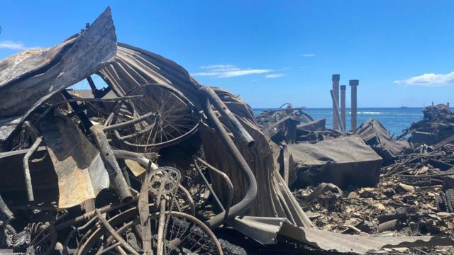 The remains of burned homes and vehicles in Lahaina, western Maui
