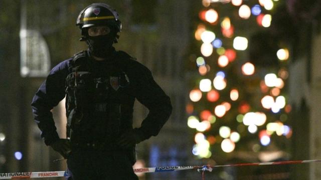 A police officer stands guard in the rue des Grandes Arcades in Strasbourg, eastern France, after a shooting, 11 December 2018