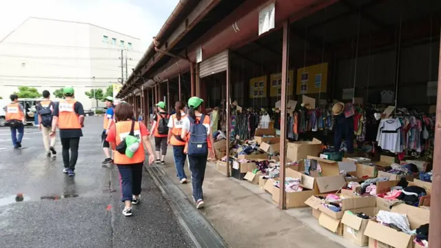 voluntários caminham pela ruaapostas no grupo bet365 copa do mundoSoja