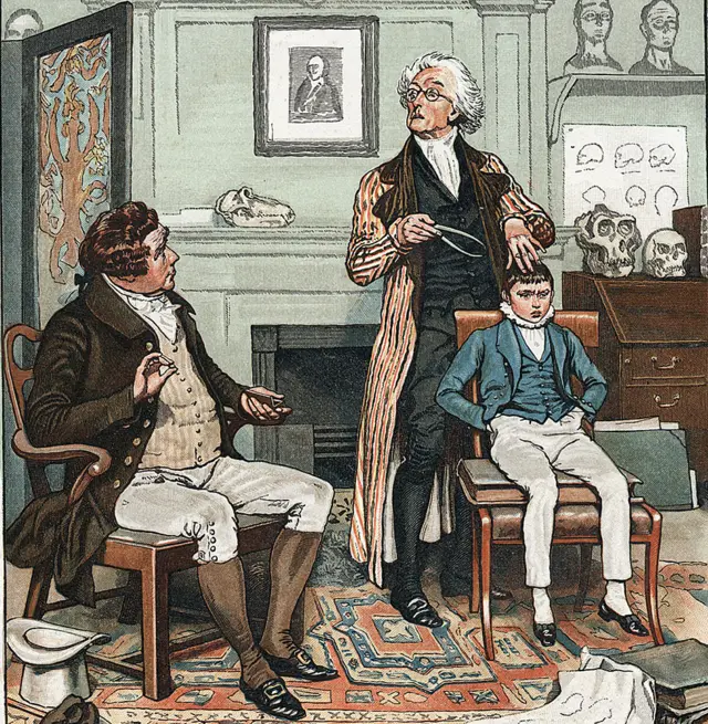Revisando la cabeza de un niño para evaluar su futuro. En la pared está la imagen de Gall (1757-1828), fundador de la teoría de que la forma del cráneo está relacionada con la capacidad y el comportamiento intelectual. Ilustración de 1886 por Frank Dadd.
