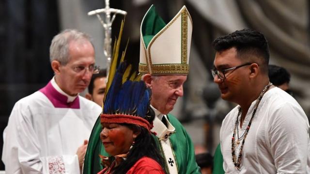 Representatives of the Amazon Rainforest's ethnic groups take part in a mass with Pope Francis on in 2019 at St. Peter's Basilica in the Vatican