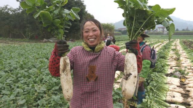 Woman holding white radishes