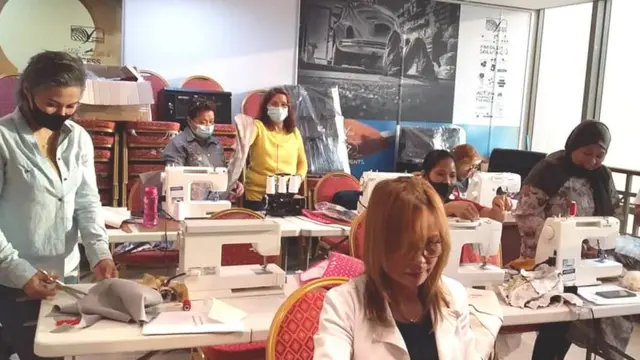 አን ከሰራተኞቿ ጋር