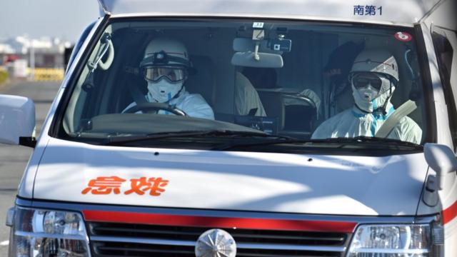 An ambulance departs the Japan Coast Guard base in Yokohama earlier this year