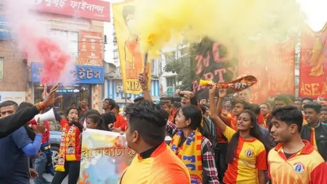Fans make their way to the Salt Lake Stadium