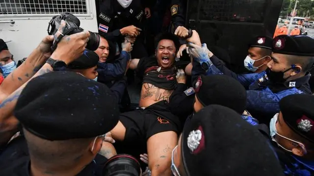 Jatupat "Pai Dao Din" Boonpattararaksa is arrested by police during a mass rally to call for the ouster of Prime Minister Prayuth Chan-ocha"s government and reforms in the monarchy, in Bangkok, Thailand, October 13, 2020.