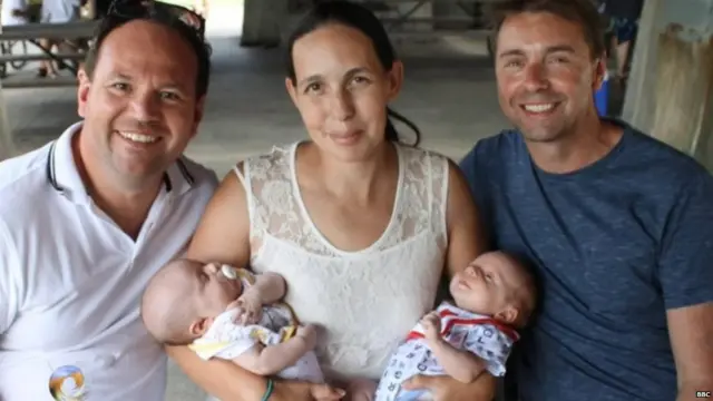 Simon and Graeme with the surrogate mother, Meg Stone, and their children