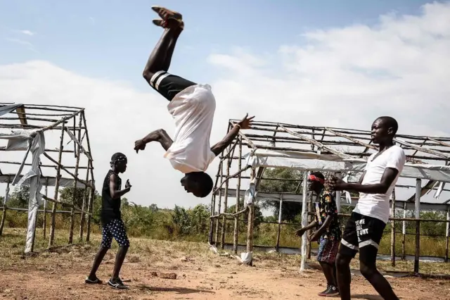 Members of the South Sudanese refugee dance group "The White Family" perform during Bidibidis Got Talent auditions at Bidibidi refugee settlement in the Northern District of Yumbe, Uganda, on November 25, 2017. The Bidibidis Got Talent project has been holding auditions across the five zones of the worlds largest refugee settlement for both refugees and members of the local community to empower youth and enhance social cohesion between different ethnic groups and with Ugandan host community. The winning groups will be mentored by established Ugandan artists after the final audition on December 9.