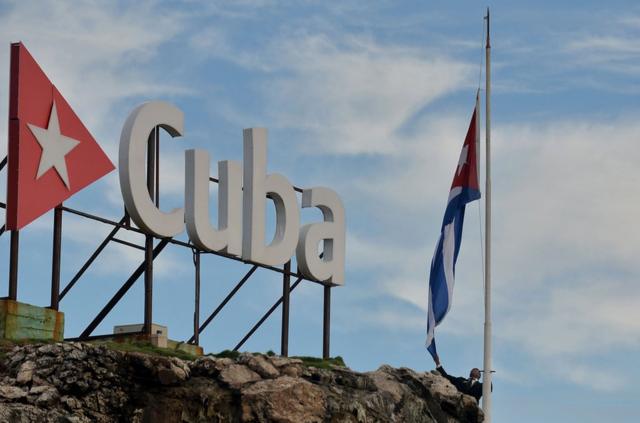 The Cuban national flag is raised at half-mast in tribute to the victims of a plane that crashed shortly after taking off from Jose Marti airport and killed 107 people, in Havana, on May 19, 2018. Cuba begins two days of national mourning Saturday for victims of the crash of a state airways plane that killed all but three of its 110 passengers and crew. President Miguel Diaz-Canel said an investigation was under way into Friday"s crash of the nearly 40-year-old Boeing 737, leased to the national carrier Cubana de Aviacion by a Mexican company. / AFP PHOTO / Yamil LAGEYAMIL LAGE/AFP/Getty Images