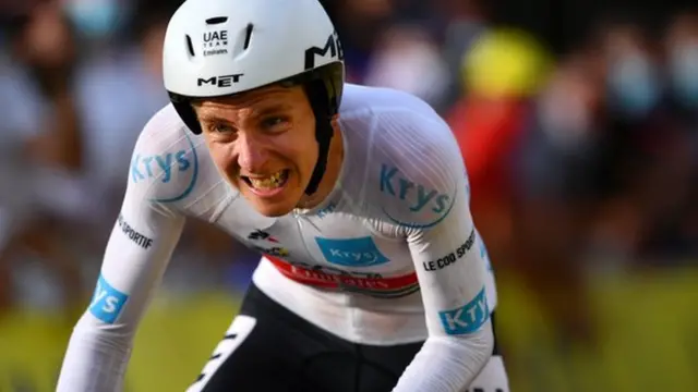 Tadej Pogacar grimaces as he wins stage 20 of the 2020 Tour de France