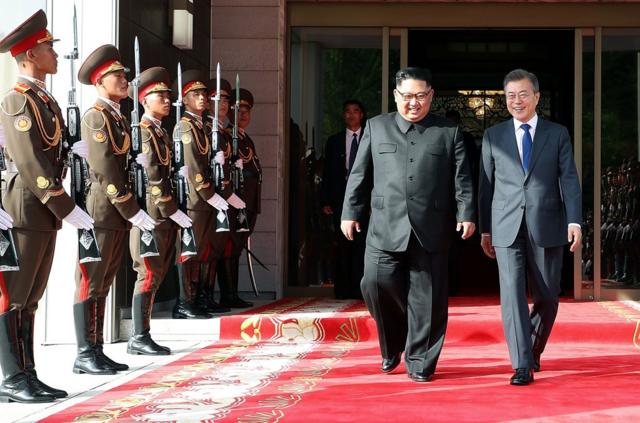 In this handout image provided by South Korean Presidential Blue House, South Korean President Moon Jae-in (R) walks with North Korean leader Kim Jong-un (L) during their meeting on May 26, 2018 in Panmunjom, North Korea. North and South Korean leaders held the surprise second summit after U.S. President Donald Trump cancelled the meeting with Kim Jong-un scheduled for June 12. Trump has since indicated that the meeting could take place a day after. (Photo by South Korean Presidential Blue House via Getty Images)