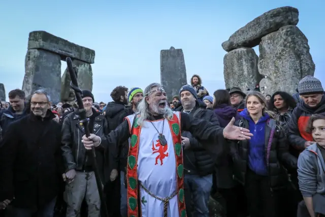 Arthur Pendragon speaks with the crowd as druids, pagans and revellers gather in the centre of Stonehenge,