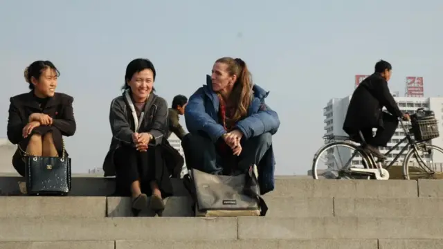 Weich (centre, in blue jacket) followed the North Korean team at the 2003 Asian Cup, the 2003 Women's World Cup and the qualification tournament for the 2004 Olympics