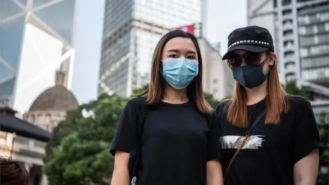 Two Hong Kong protesters wearing face masks, 5 October 2019