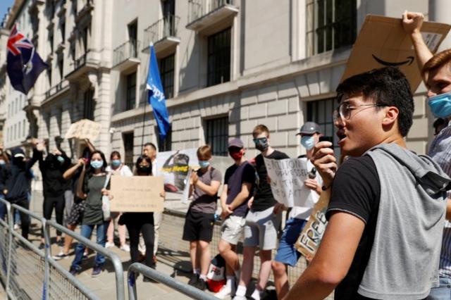 A former British Consulate employee, Simon Cheng, speaks during a protest against Hong Kong"s deteriorating freedoms outside China"s embassy, in London, Britain, July 31, 2020