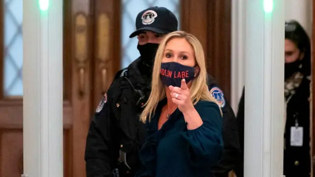 Marjorie Taylor Greene goes through security at Congress