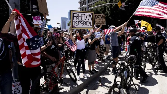 People protest during a reopen California demonstration, amid the coronavirus pandemic, in Los Angeles, California, USA, 01 May 2020