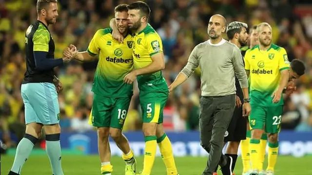 Norwich celebrate after beating Manchester City