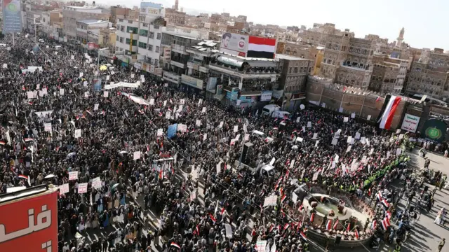 Houthi followers rally in the Yemeni capital of Sanaa, five years after the rebels captured the city