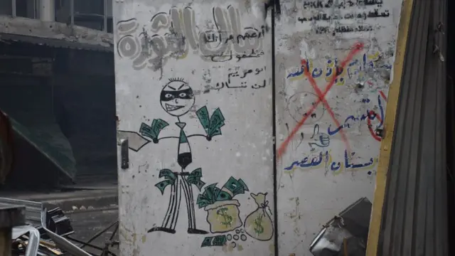 "Devrim parası" yazılmış olan Özgür Suriye Ordusu (ÖSO) karşıtı resim