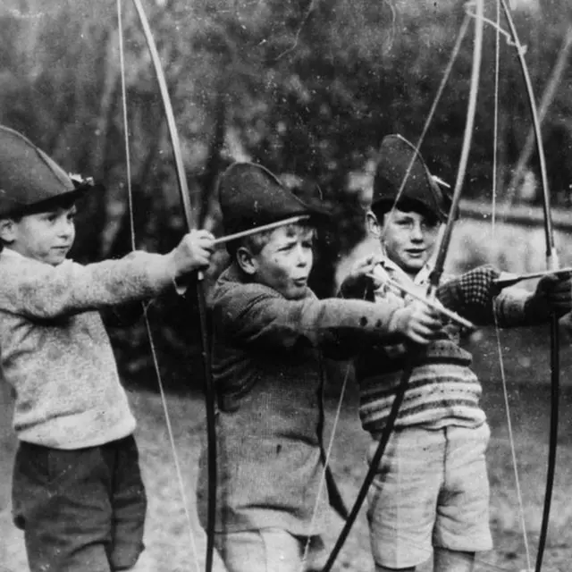 Prince Philip (centre) during archery practice at school