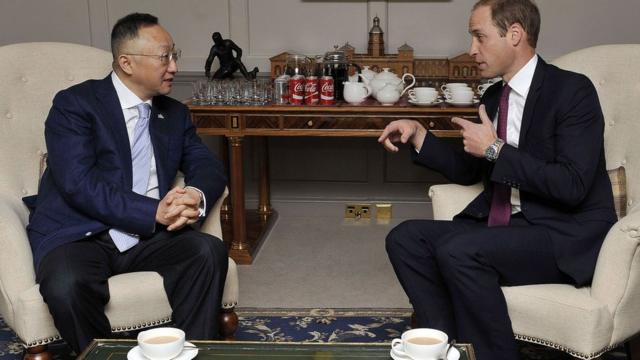 Britain's Prince William, Duke of Cambridge with Sanpower Group Chairman Yuan Yafei, at Kensington Palace Oct 2015 where the Prince, in his role as President of United For Wildlife, attended the signing of a memorandum of understanding between The Royal Foundation of The Duke and Duchess of Cambridge and Prince Harry and Sanpower, enabling United for Wildlife to create two ranger training stations in Africa