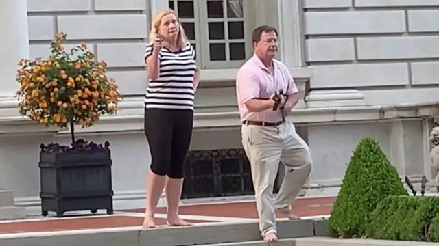 A couple pointed guns at protesters in Missouri