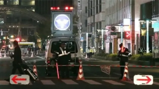 Policemen stood guard on the street in Fukuoka after it was temporarily closed over the weekend