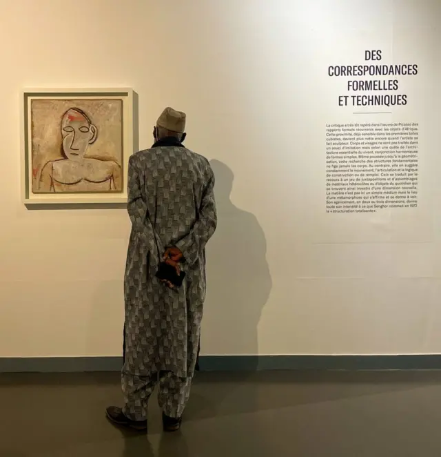 A man looks at artworks by Pablo Picasso at a dedicated exhibition at Dakar's Musée des Civilisations Noires.