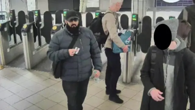 Khan passing through London Underground