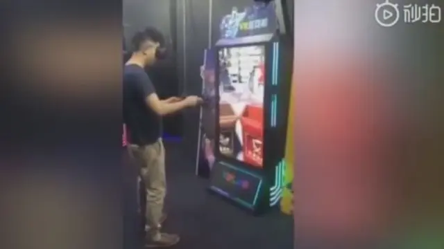 A man playing a VR recycling game