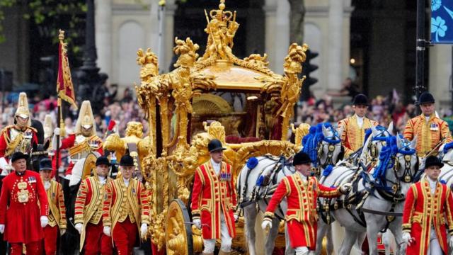 Britain's King Charles III and Queen Camilla are on the way to Buckingham Palace following his coronation in London Saturday, May 6, 2023