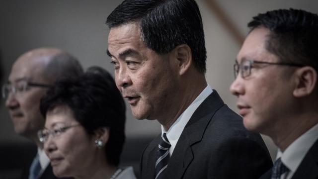 Hong Kong Chief Executive Leung Chun-ying (C) addresses a press conference in Hong Kong on April 22, 2015. Hong Kong's government announced a roadmap for leadership elections which offered no concessions to the city's democracy camp -- prompting opposition lawmakers to walk out of the plan's unveiling.