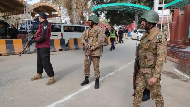 Pakistani Army soldiers stand guard near the scene of a blast at a Mosque, in Peshawar, Pakistan, 30 January 2023.