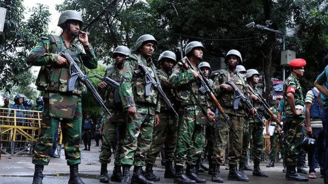 Bangladeshi soldiers stand guard in the capital Dhaka