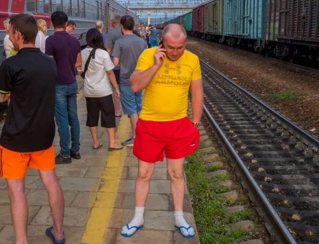 A football fan on the phone