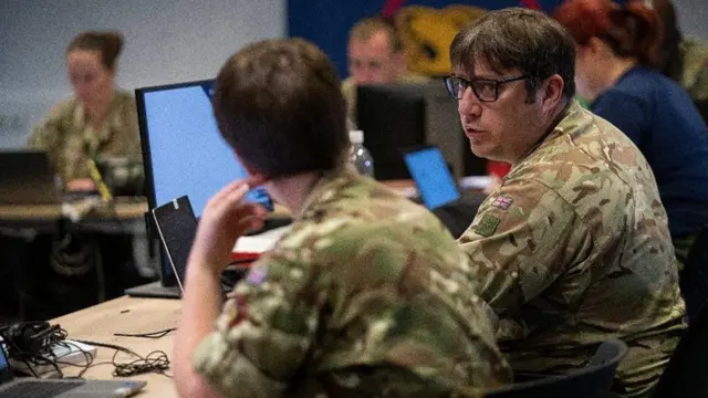 EUCOM Control Center – Ukraine / International Donor Coordination Centre staff members from the United Kingdom and United States, Patch Barracks, Germany, 3 June 2022