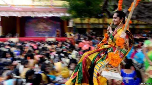 1. An Indian student reacts on a swing during celebrations for Pongal, the Tamil harvest festival, at a college in Chennai