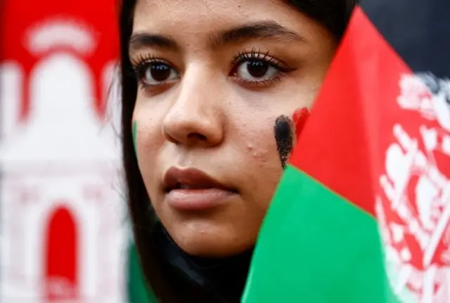 A woman attends a rally against the Taliban and in solidarity with the people of Afghanistan, on the Place de la Republique square in Paris, France, August 22, 2021