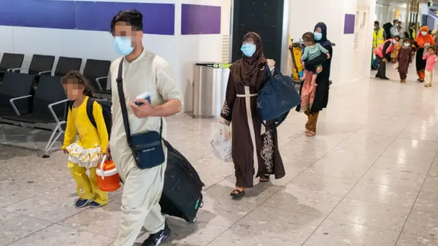 Refugees from Afghanistan arrive on a evacuation flight at Heathrow Airport on August 26, 2021 in London, England.