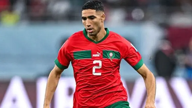 Moroccan defender Achraf Hakimi playing at the 2022 FIFA World Cup in Qatar where Morocco reached the semi-finals.