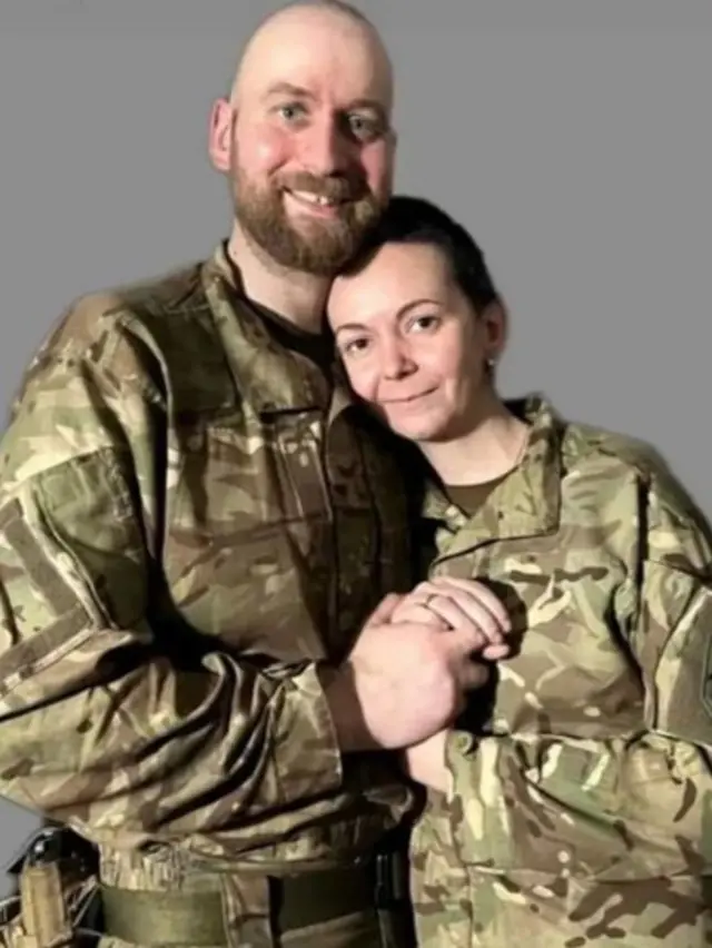 Andriy and Valeria in military uniforms