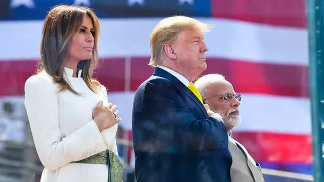 Donald Trump and im wife dey respect national anthem