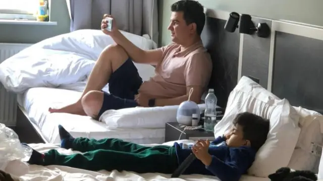 Burhan and his son Sephr in a hotel in London