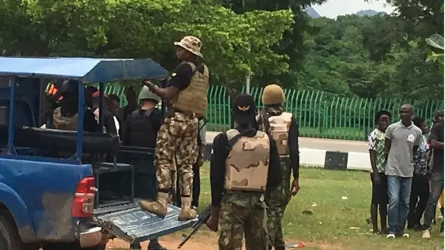 Soldiers and police dey ground to control di protests