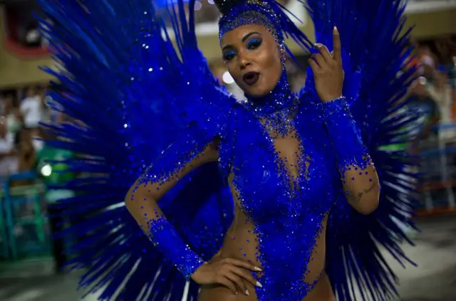 A reveller of the Imperatriz Leopoldinense samba school performs during the second night of Rio"s Carnival at the Sambadrome in Rio de Janeiro, Brazil, on February 13, 2018. / AFP PHOTO / Mauro PIMENTELMAURO PIMENTEL/AFP/Getty Images
