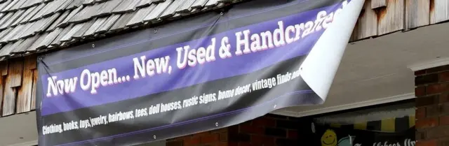 Cartel de "Recién inaugurado"