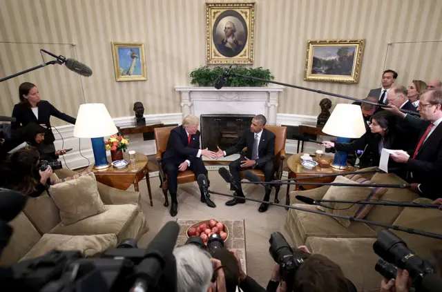 US President Barack Obama shakes hands with President-elect Donald Trump following a meeting in the Oval Office on 10 November 2016 in Washington, DC.