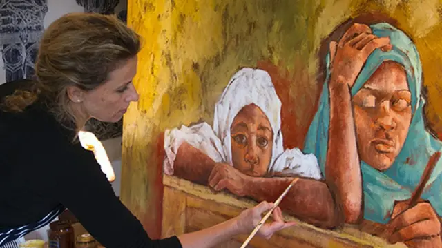 British born Polly Alakija dey paint inside her studio