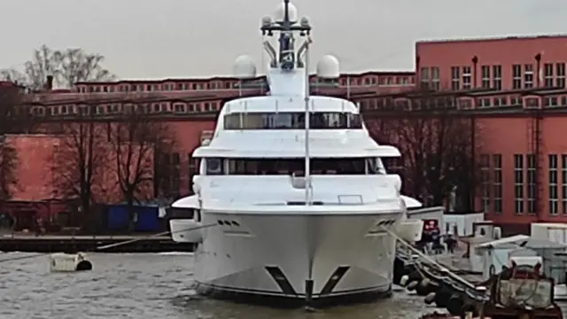 Graceful in port in front of some buildings